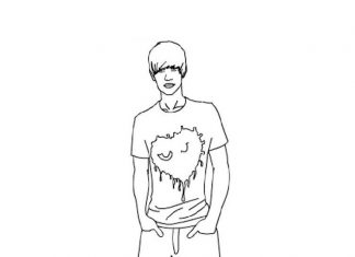 Chłopak trzyma ręce w kieszeni